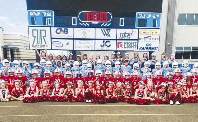 The Greenwood Rangers and Greenwood Outlaws youth programs took a group picture before their game last weekend.