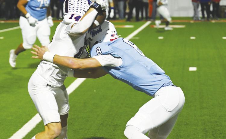 Greenwood’s Kasen Brooks makes a picture perfect tackle during the Ranger’s big win over Graham last week.